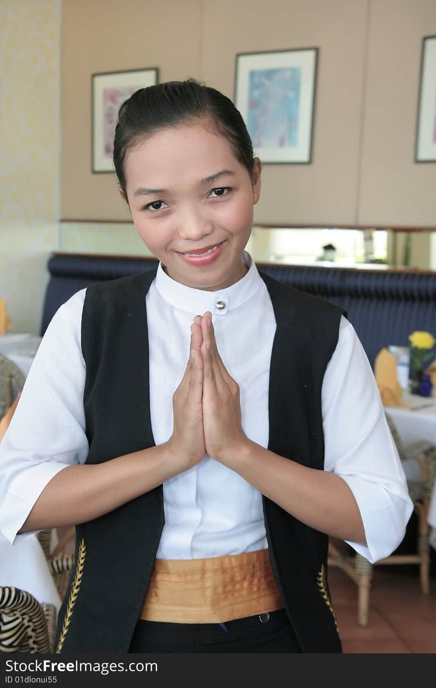 Asian waitress at work greeting