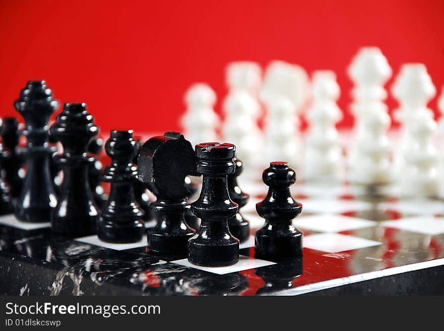 Black and white chessboard on red background