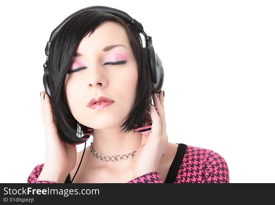 Emo girl in headphones listen to music on gray background. Emo girl in headphones listen to music on gray background
