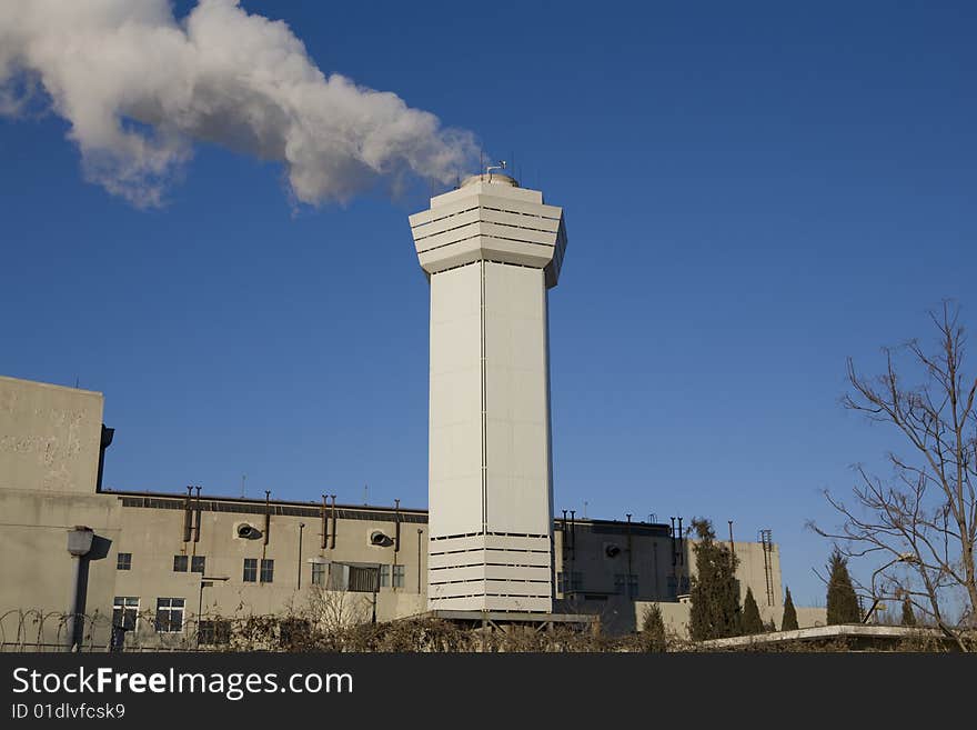 Large cloud of steam coming from a stack. Large cloud of steam coming from a stack