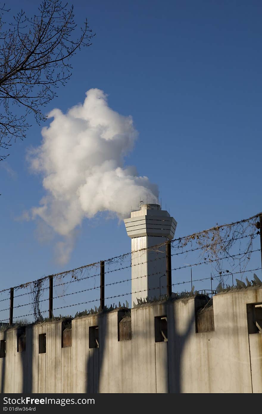 Large cloud of steam coming from a stack. Large cloud of steam coming from a stack