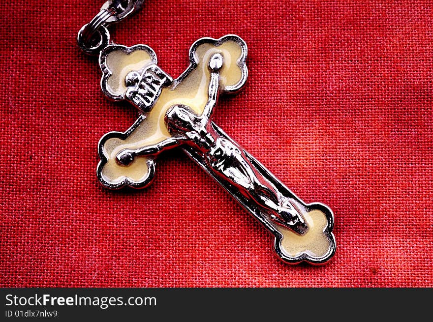 Rosary in macro over red cloth background. Rosary in macro over red cloth background