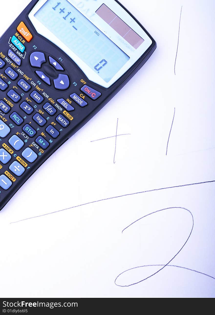 Closeup of the calculator on the paper