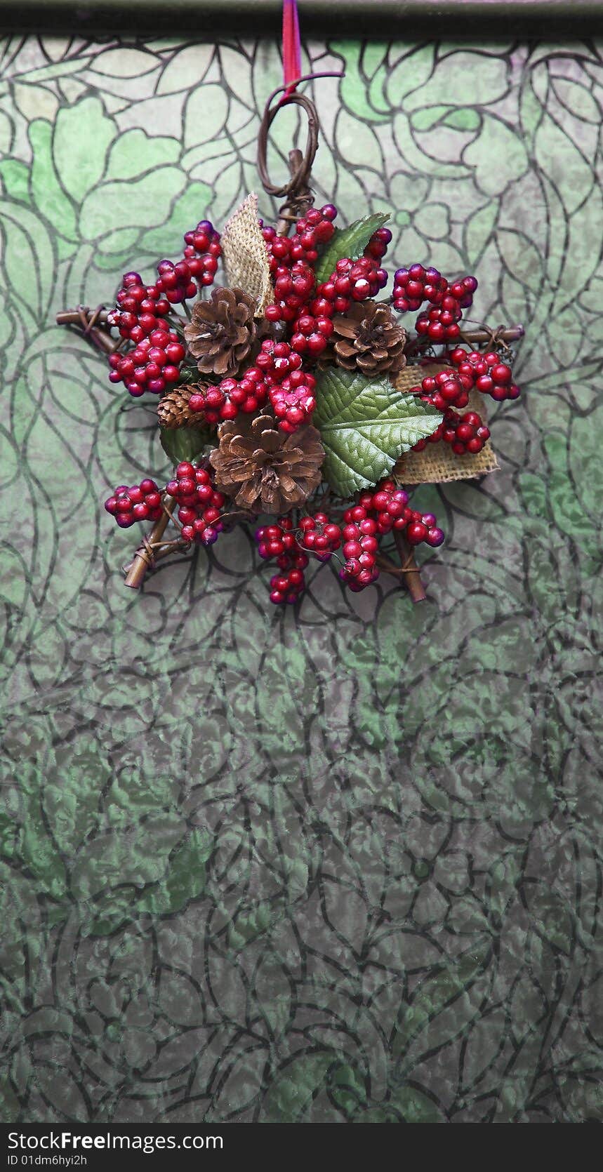 A christmas garland on a liberty glass door