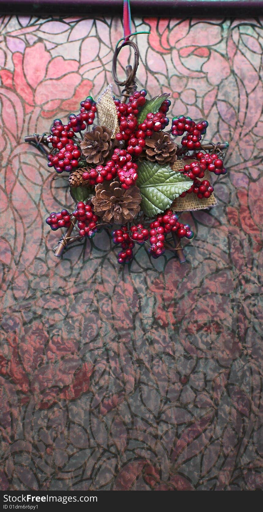 A christmas garland on a liberty glass door