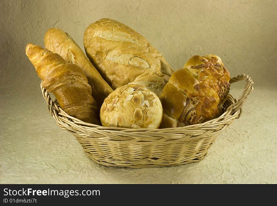 Different kids of bread in Basket. Different kids of bread in Basket