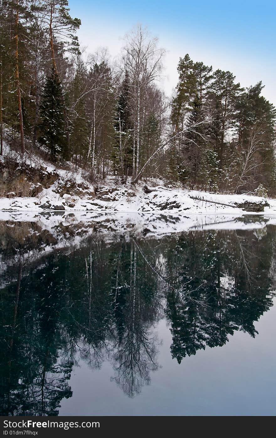 Nonfreezing Blue lake in Mountain Altai. Siberia.