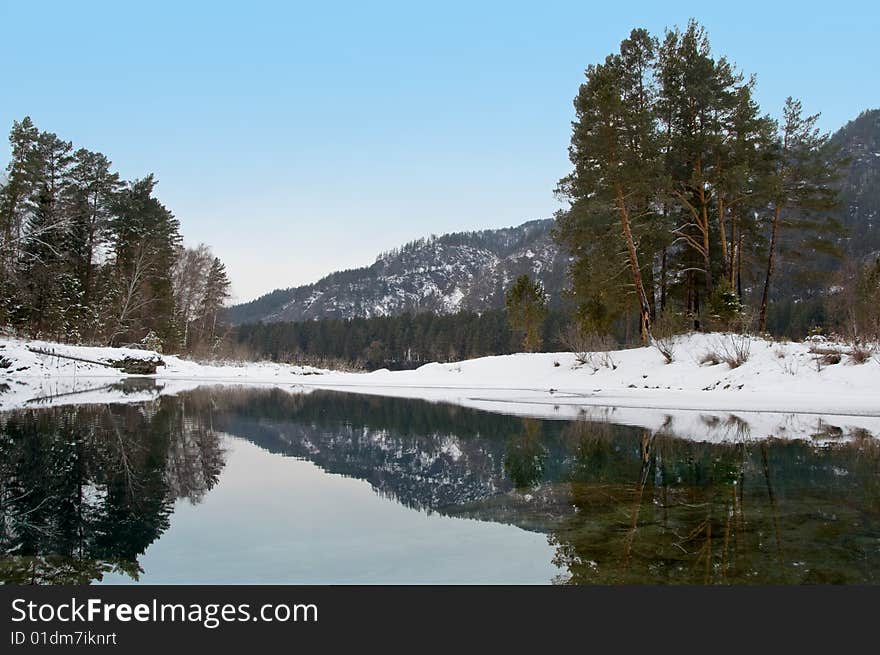 Nonfreezing Blue Lake In Mountain Altai.