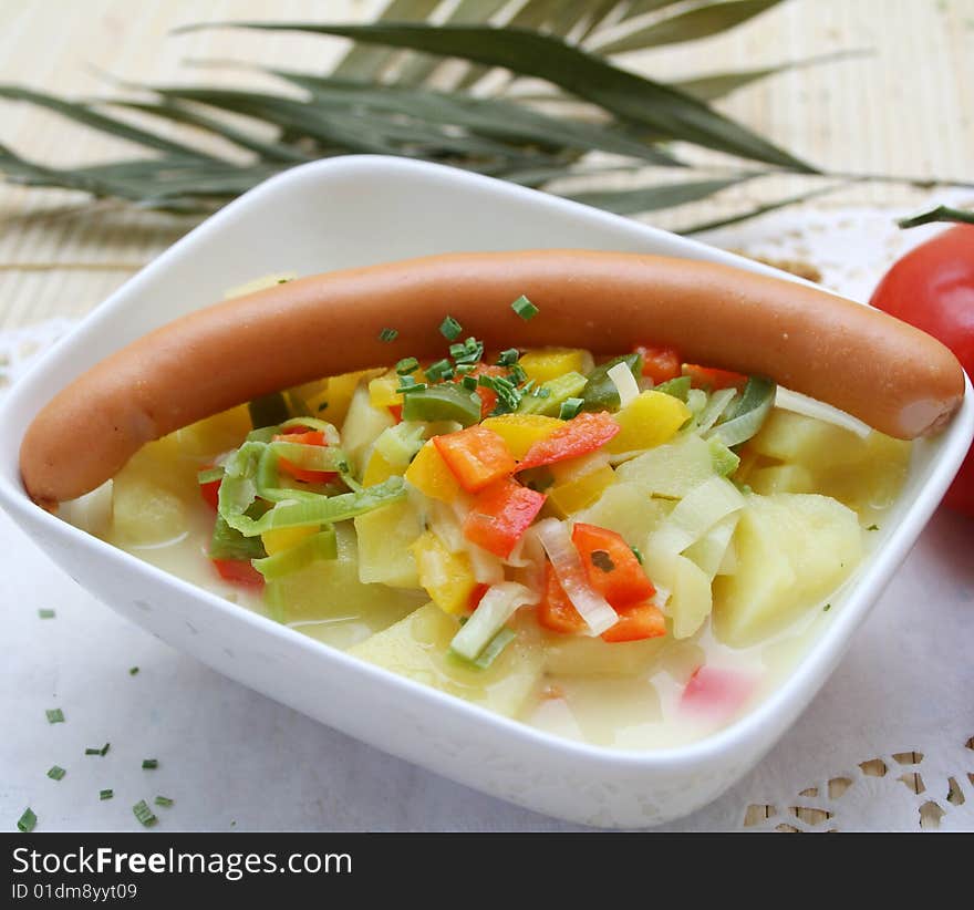 A fresh soup of potatoes with sausages