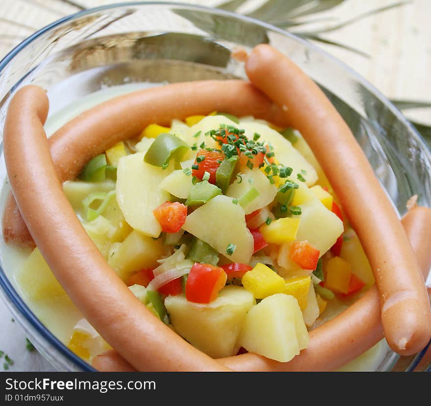 A fresh soup of potatoes with sausages