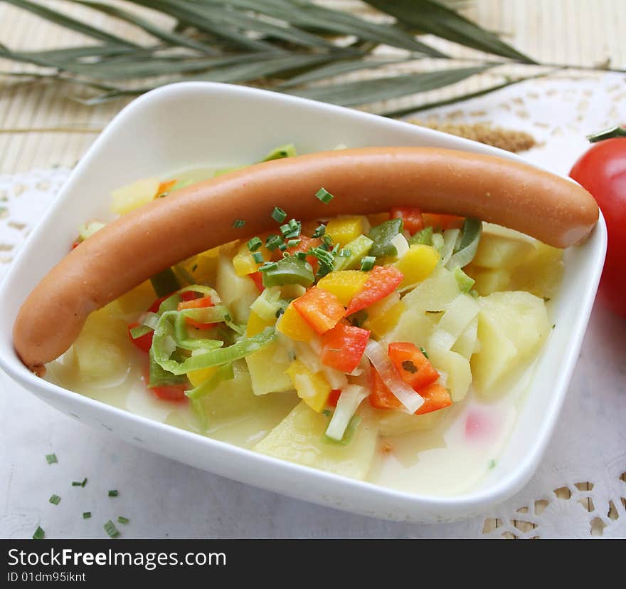 A fresh soup of potatoes with sausages