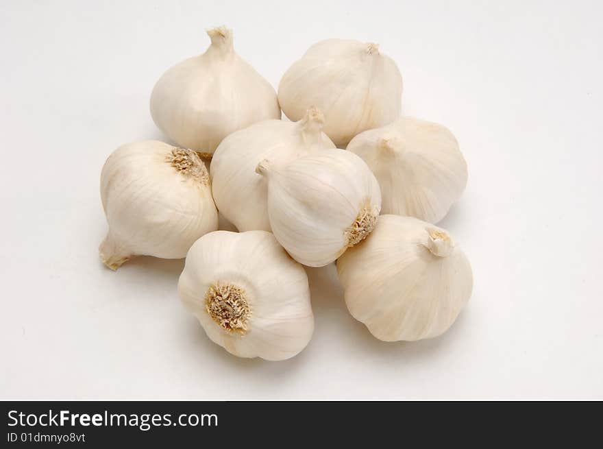 Several garlics on grey background