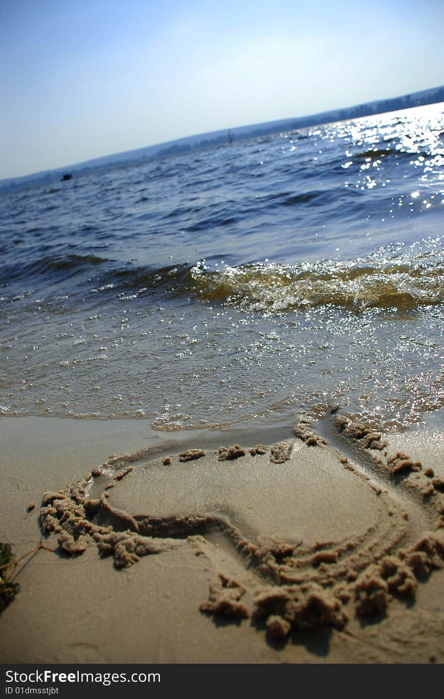 Shape of heart on the sand at the beach