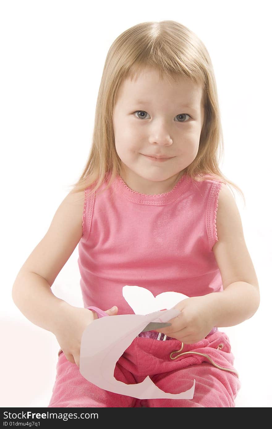 Pretty Small Girl Is Cutting Paper Heart Shape