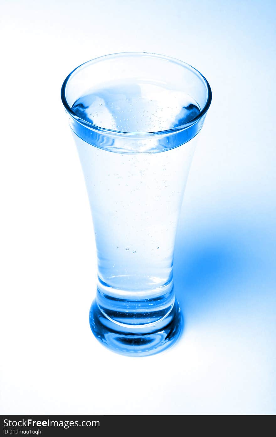 Glass of water in blue light