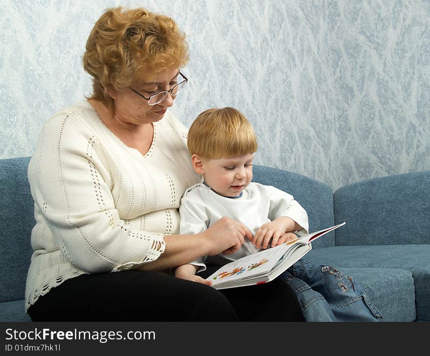 Portrait of the grandmother with the grandson in house conditions