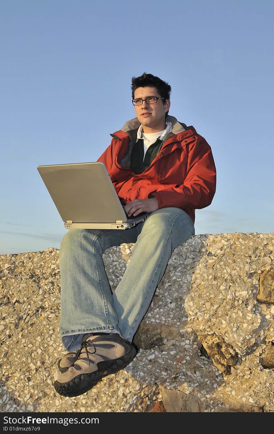 Young man with laptop outdoor