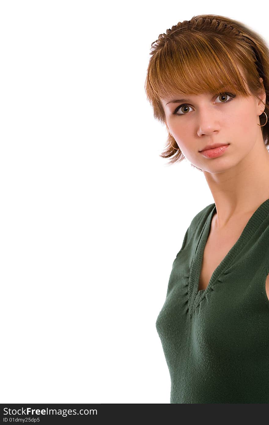 Portrait of the brunette in a dark green dress on a white background. Isolated