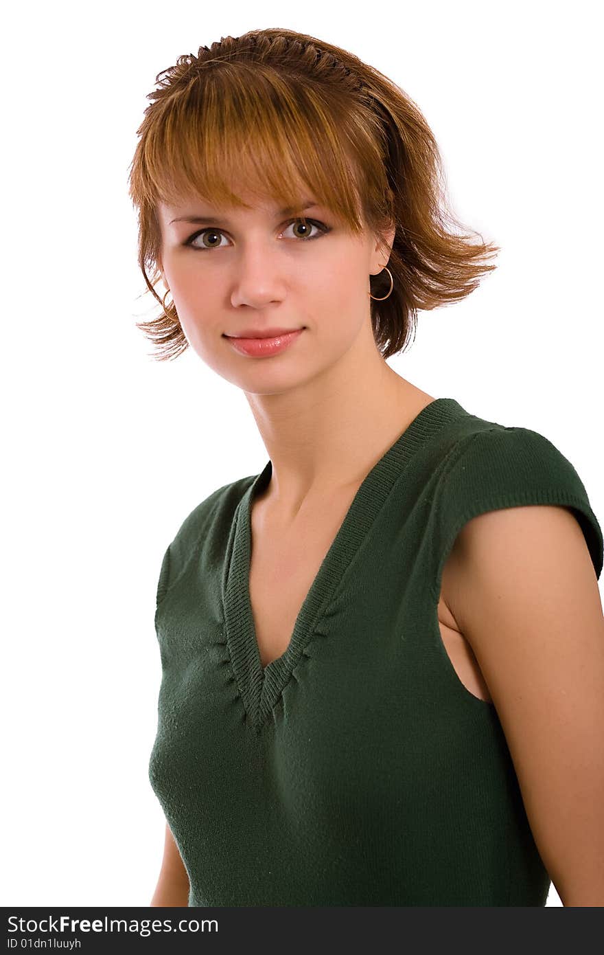 Portrait of the brunette in a dark green dress on a white background. Isolated