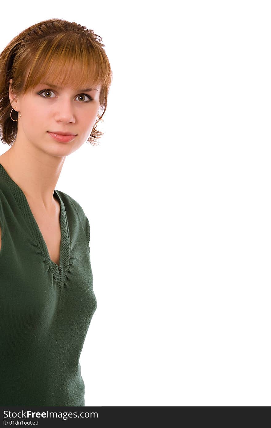 Portrait of the brunette in a dark green dress on a white background. Isolated