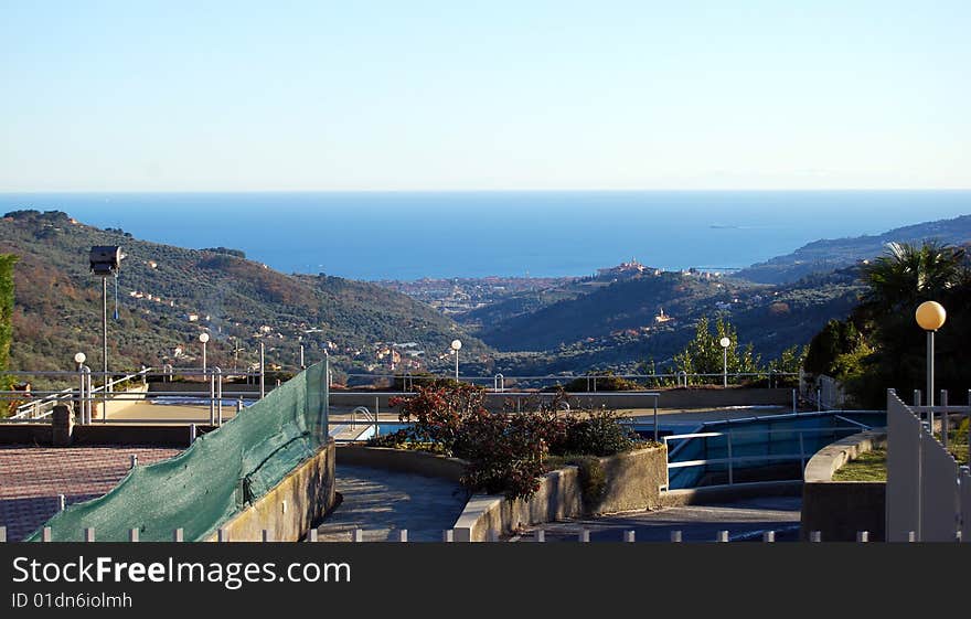 View from Evigno, a characteristic ligurian village, of the city of Diano Marina near the sea, the medioeval village of Diano Castello on the right and all the valley.