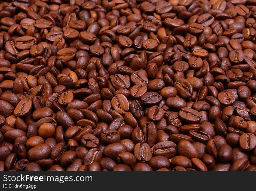 Roasted coffee beans background in perspective. Roasted coffee beans background in perspective