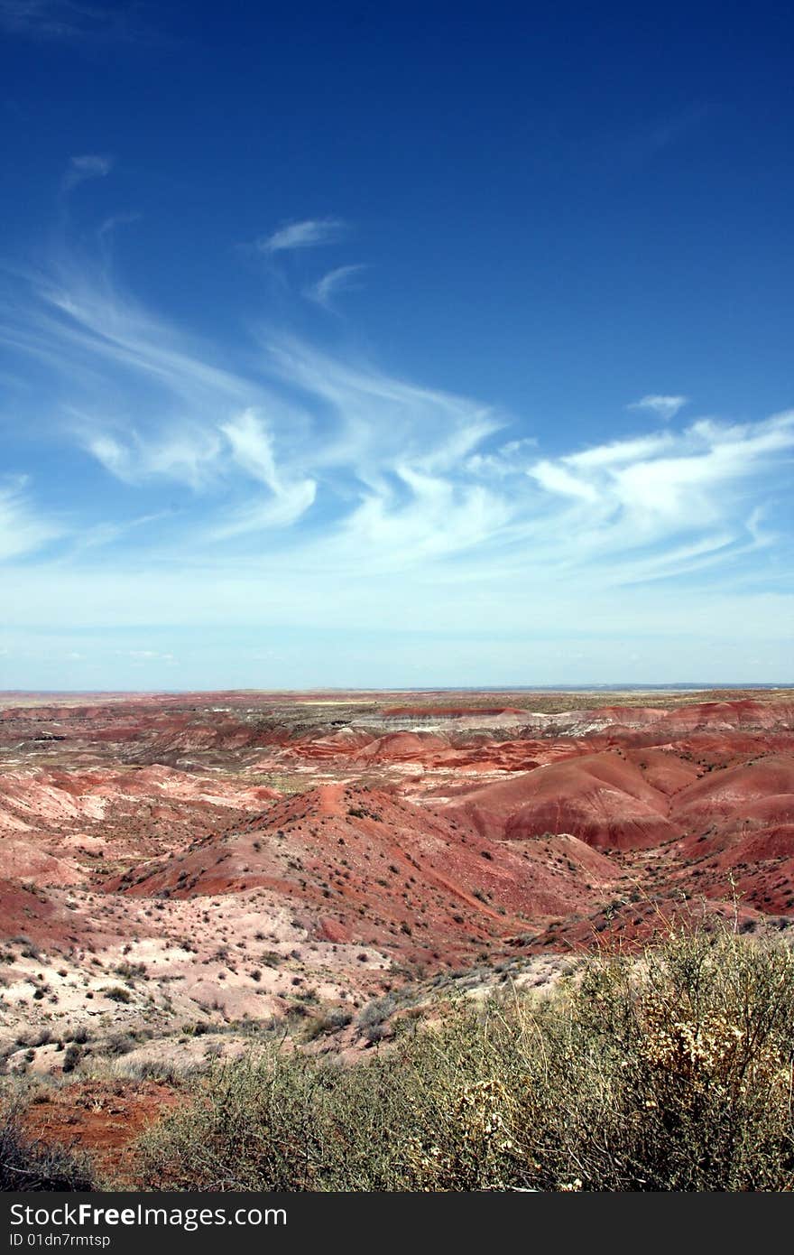 Painted desert in Arizona with wispy stratus clouds in  blue sky