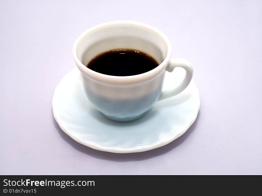 Black koffee, is white in cup. Isolated on blue background. Black koffee, is white in cup. Isolated on blue background.