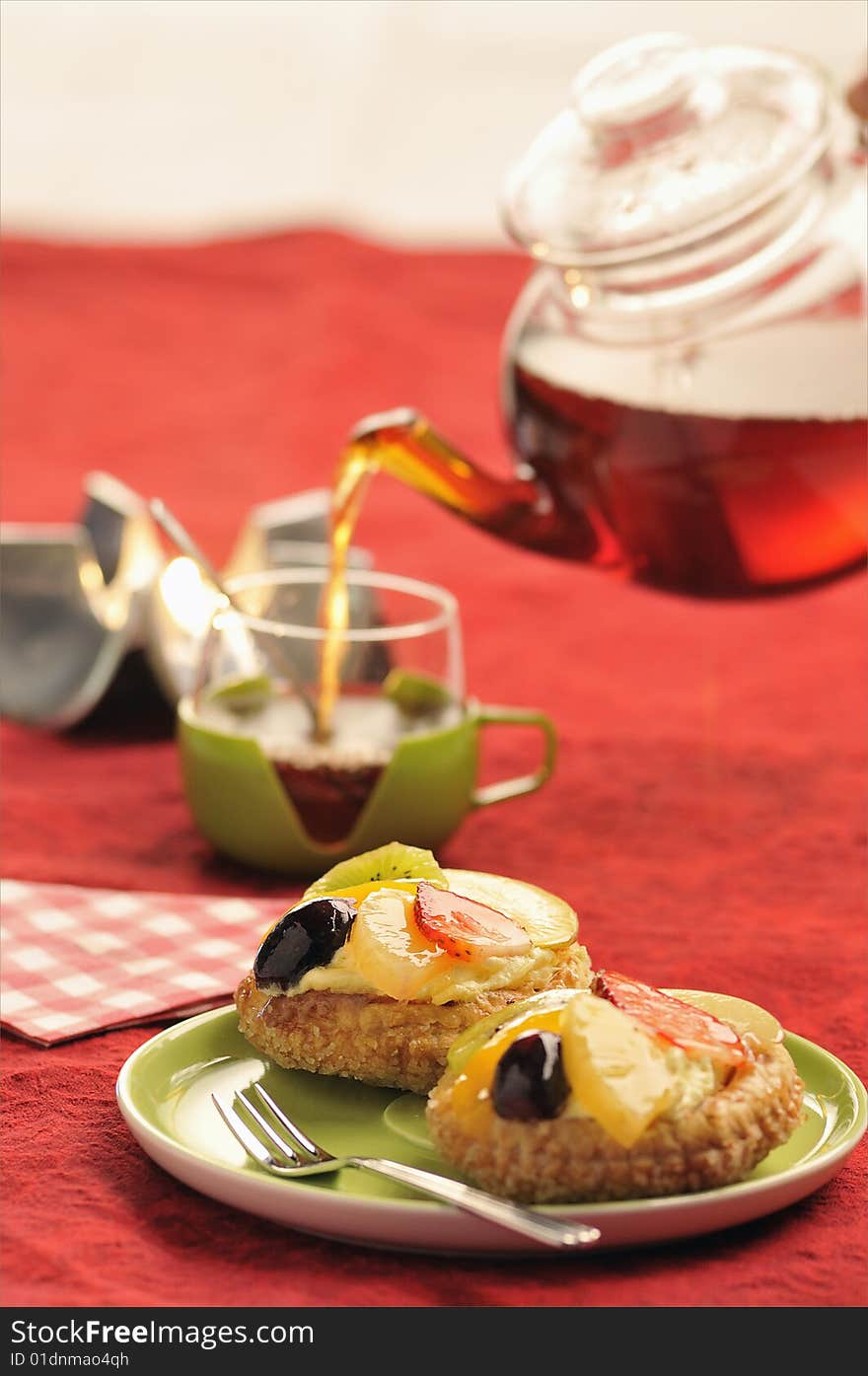 tasty cake with fresh fruit and  tea