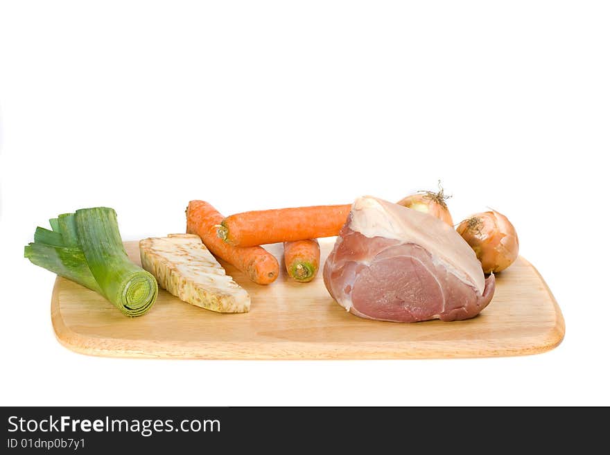 Raw pork meat and sauce ingredients on a wooden plate