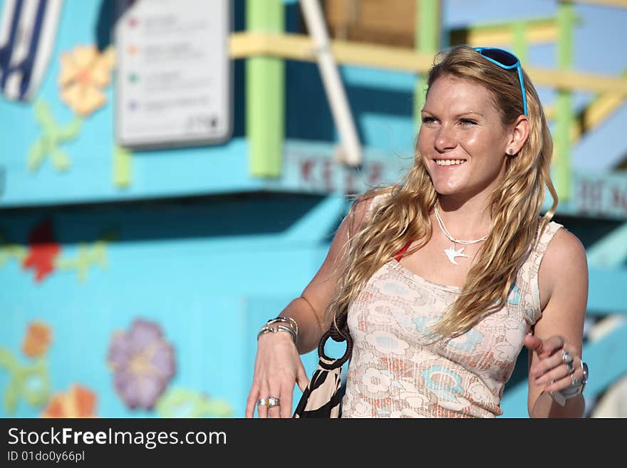 Beautiful woman with a lifeguard hut in the background. Beautiful woman with a lifeguard hut in the background