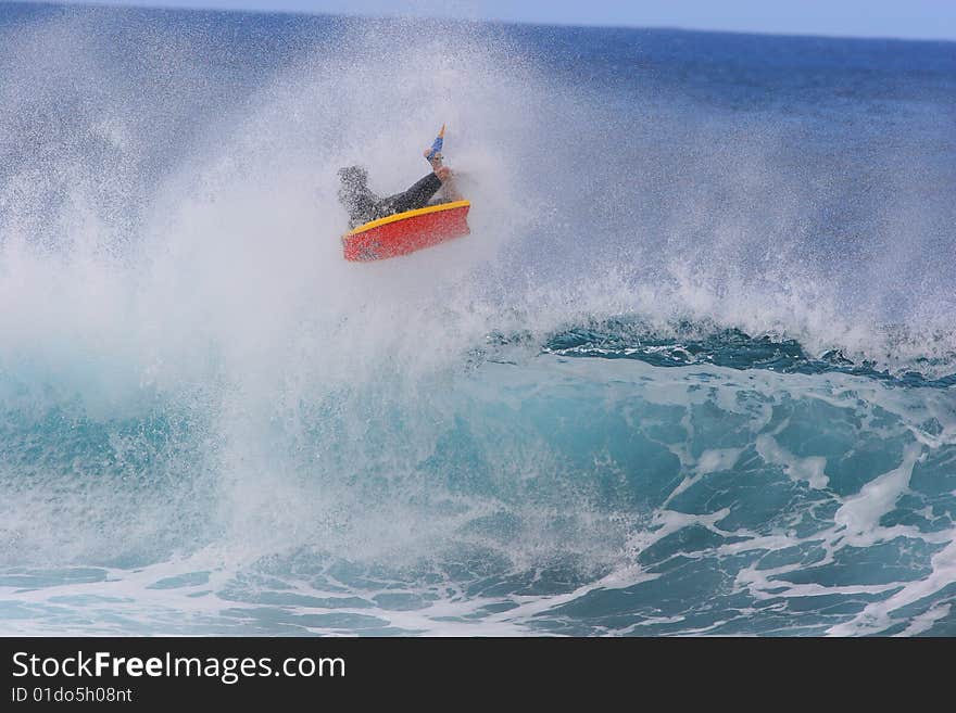 A bodyboarder catches air at the world famous Bonzai Pipline wave on the North Shore of Oahu Hawaii. A bodyboarder catches air at the world famous Bonzai Pipline wave on the North Shore of Oahu Hawaii.