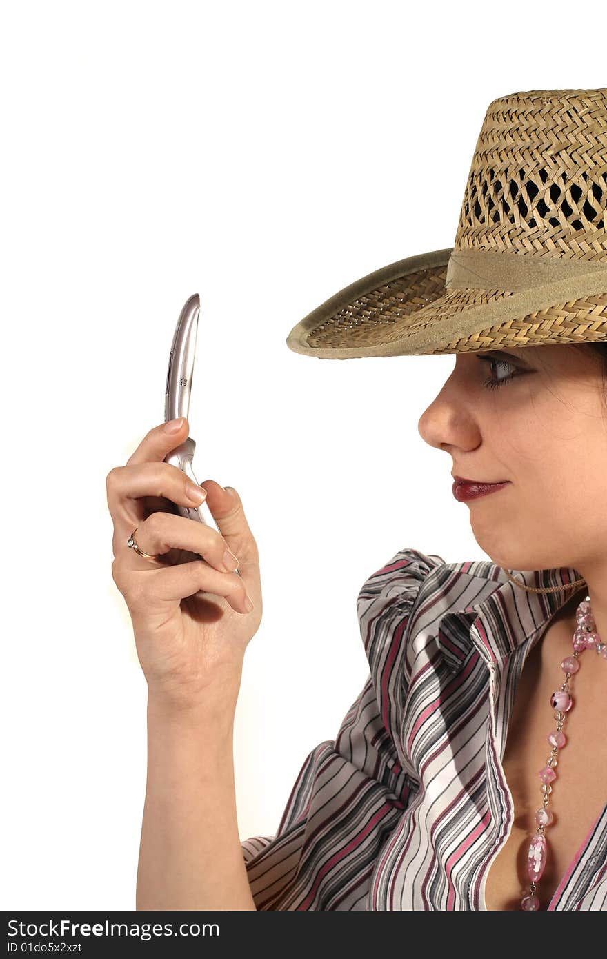 Young woman in cowboy hat with mobile phone. Young woman in cowboy hat with mobile phone