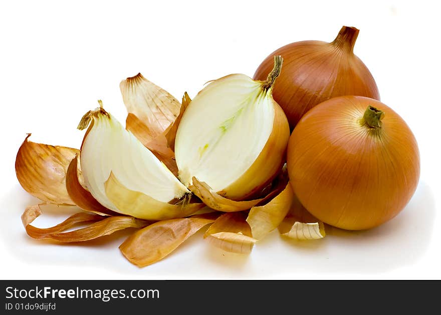 Three large golden onions isolated on the white