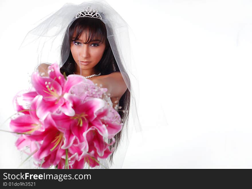 Young bride with bouquet of lilys on a white background