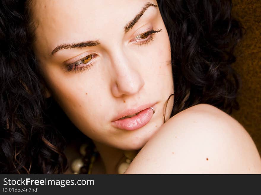 Young beautiful curly woman portrait