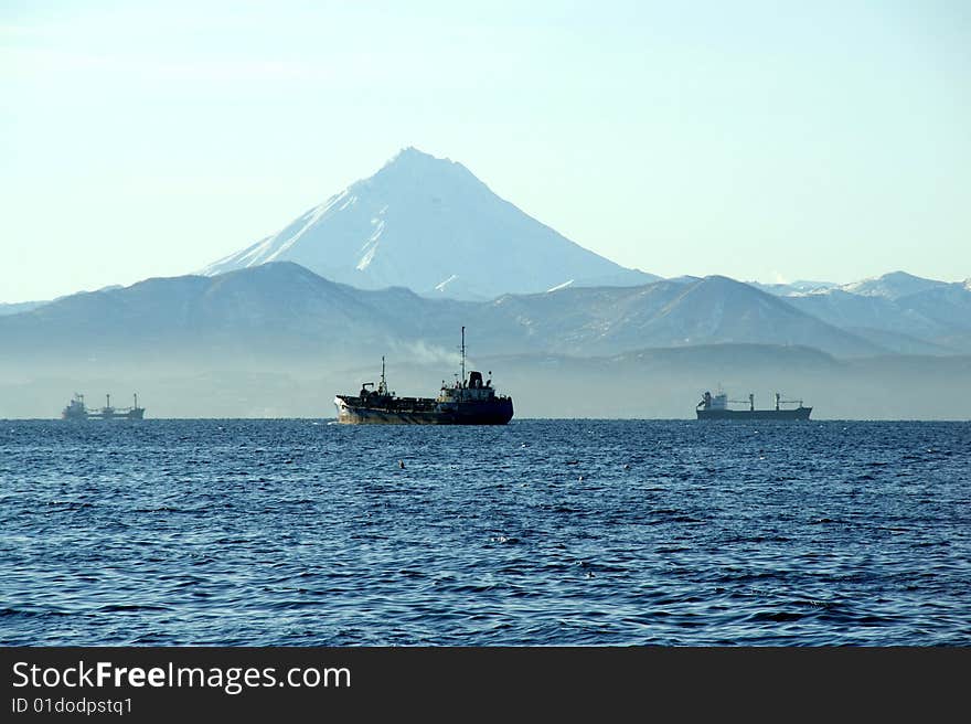 Three ships  on roadstead in bay of the Pacific ocean