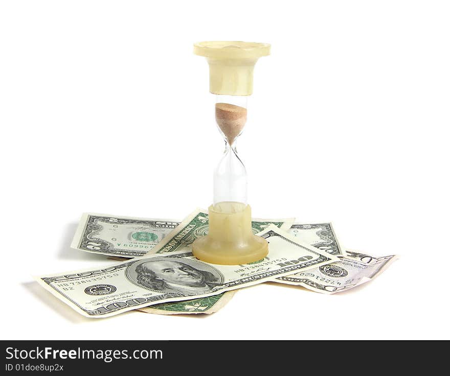 On white background dollars bills and hourglass