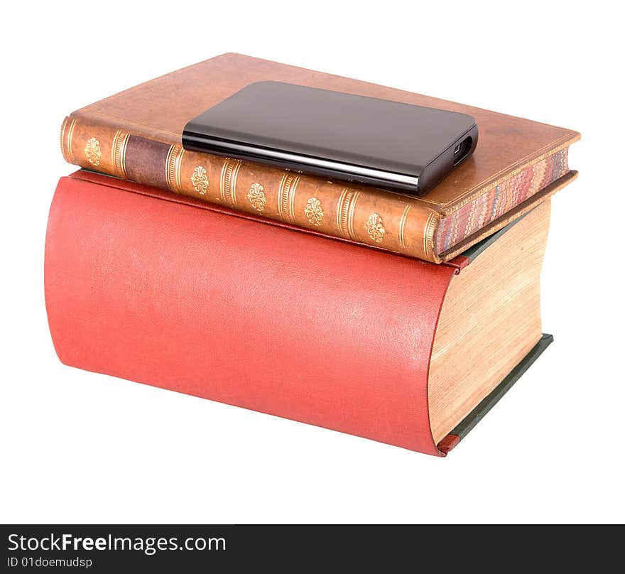 Old leather bound books with a computer hard drive isolated on a white background