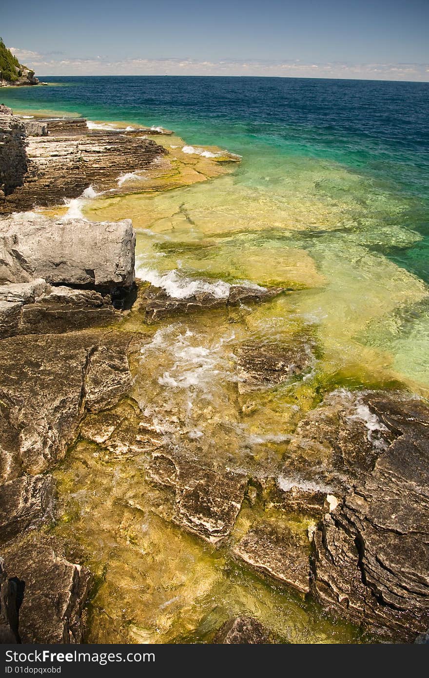 Open tropical water on rocky shelf beach. Open tropical water on rocky shelf beach.