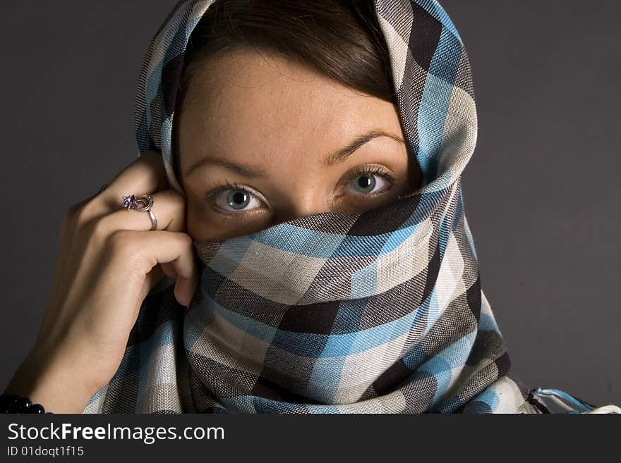 Portrait of young east woman with half closed face