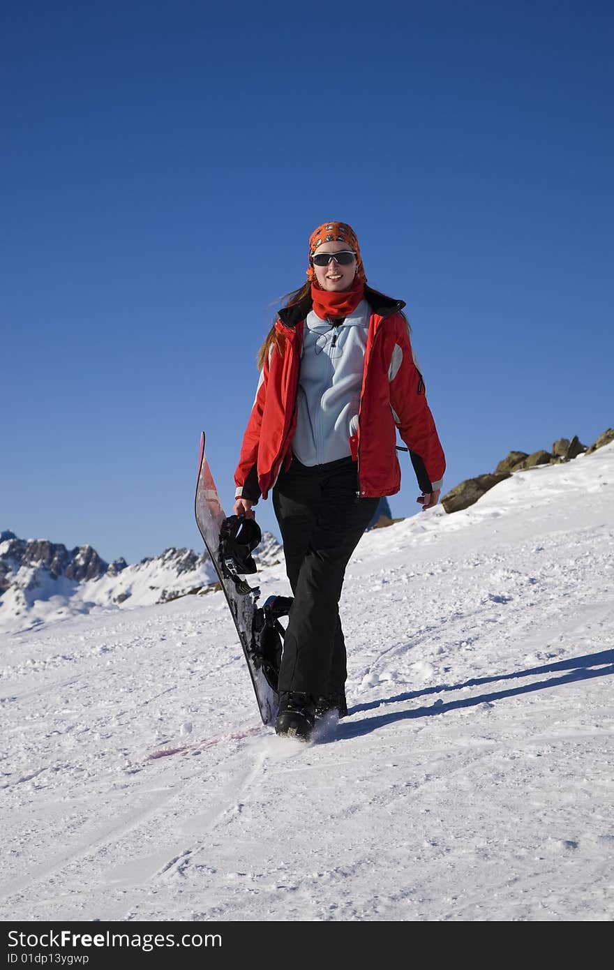 Young woman with snowboard