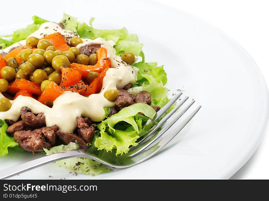 Chicken Salad Composed Chicken Liver and Pepper Dressed with Salad Leaves and Green Peas. Isolated on White Background