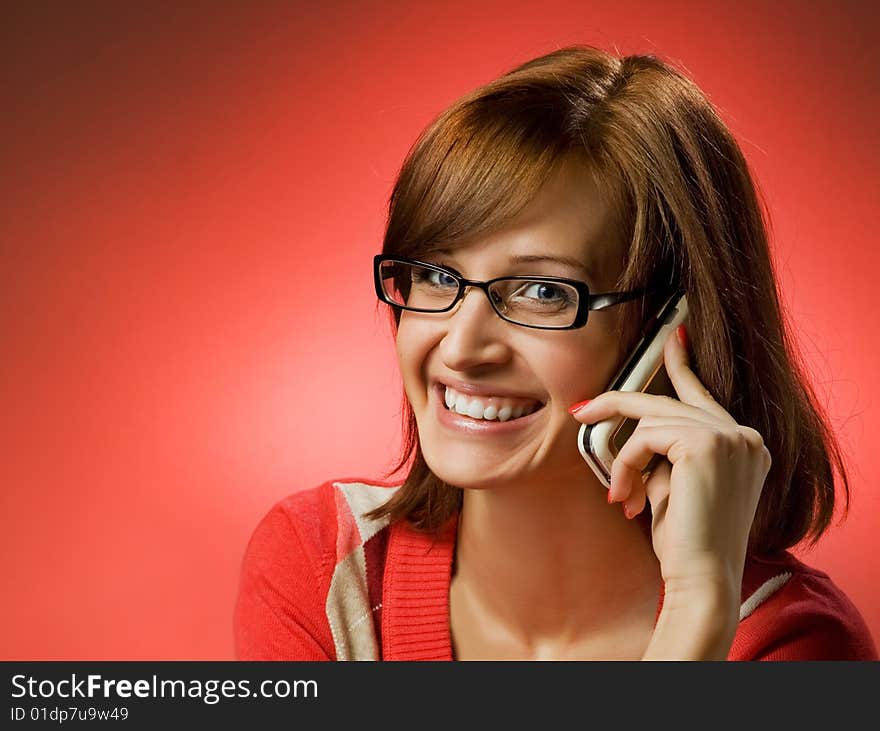 Beautiful smiling woman using a mobile phone