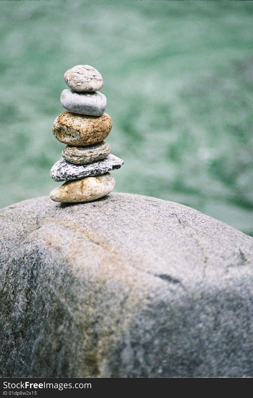 Stone pillgrim in swiss river