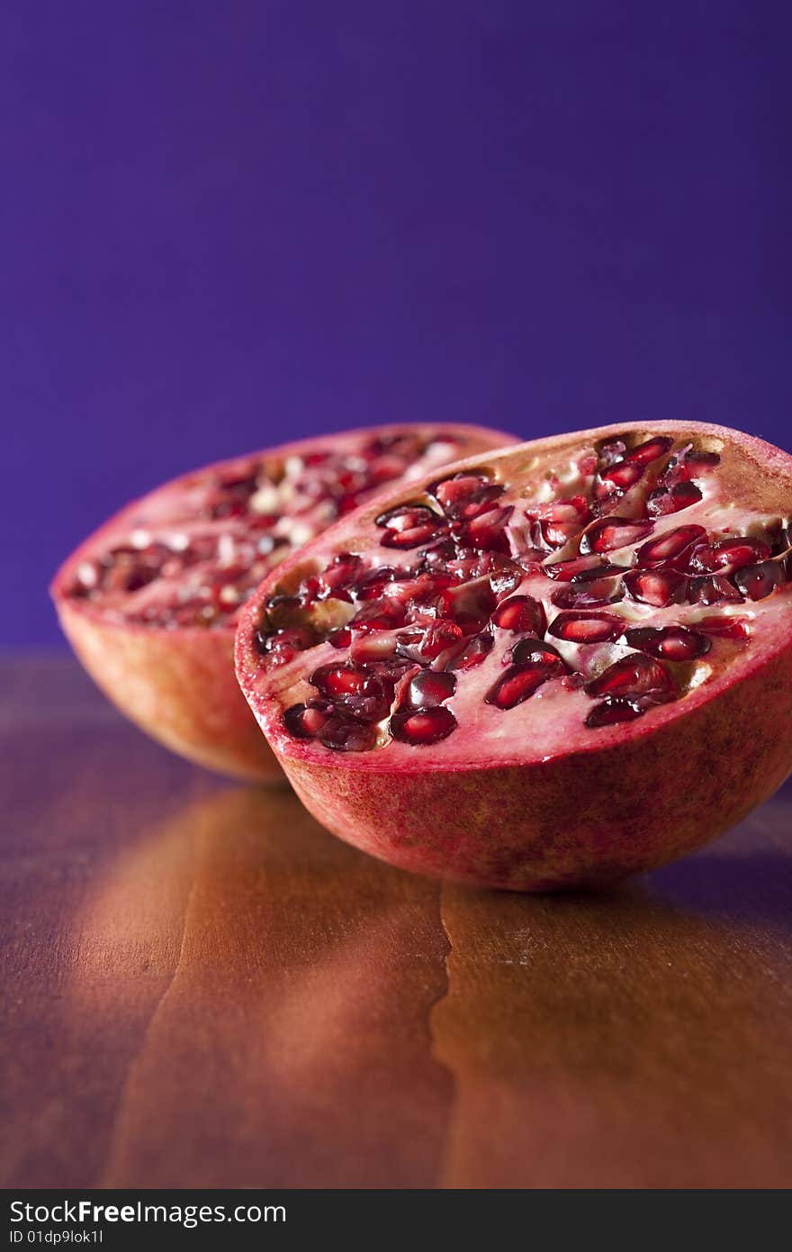 Fresh pomegranate halves, tropical fruit