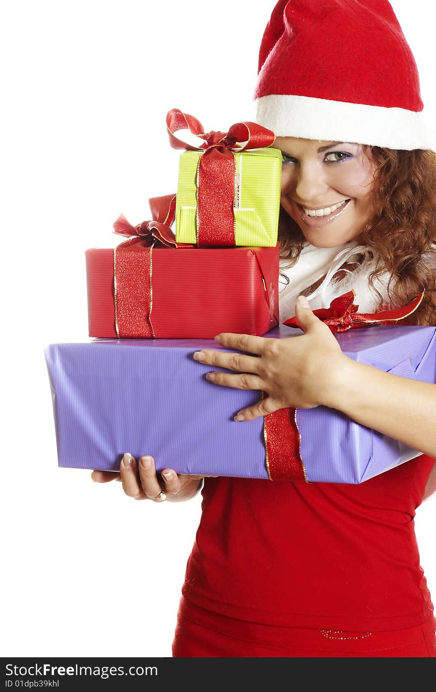 The attractive girl in Christmas with beautiful gifts. The attractive girl in Christmas with beautiful gifts