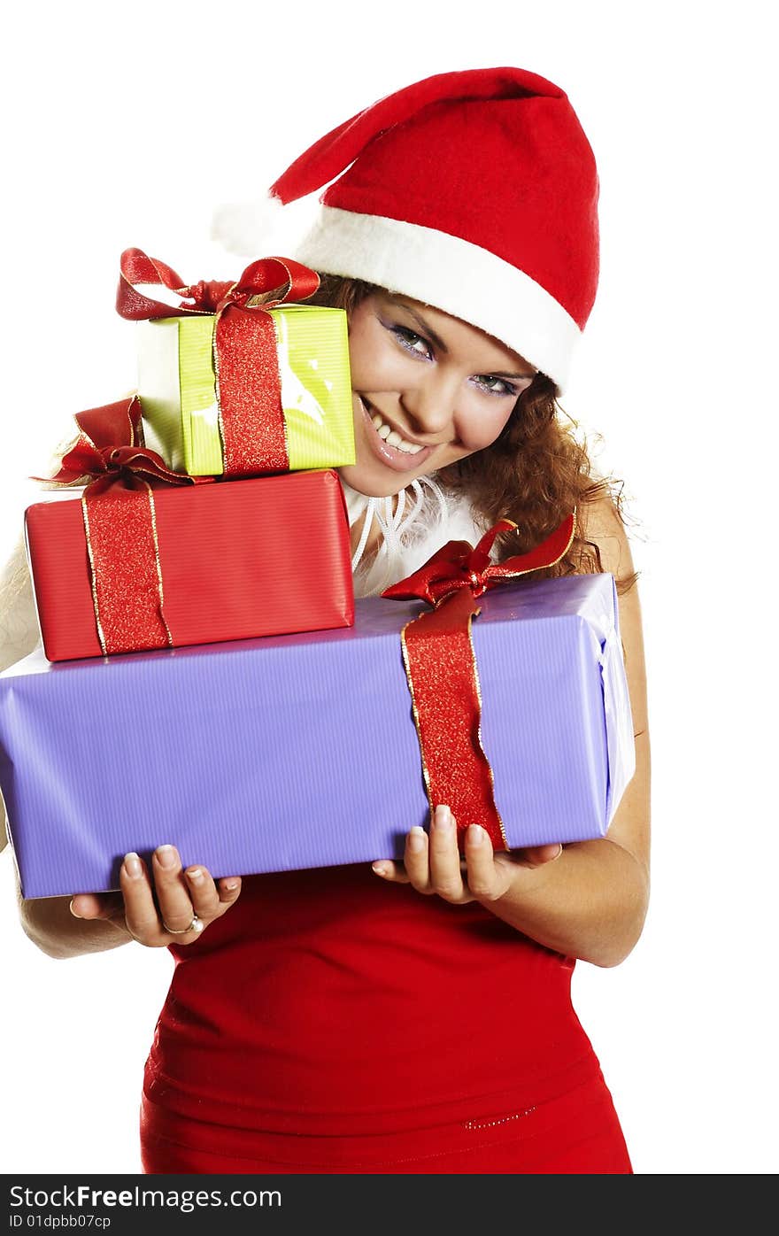 The attractive girl in Christmas with beautiful gifts