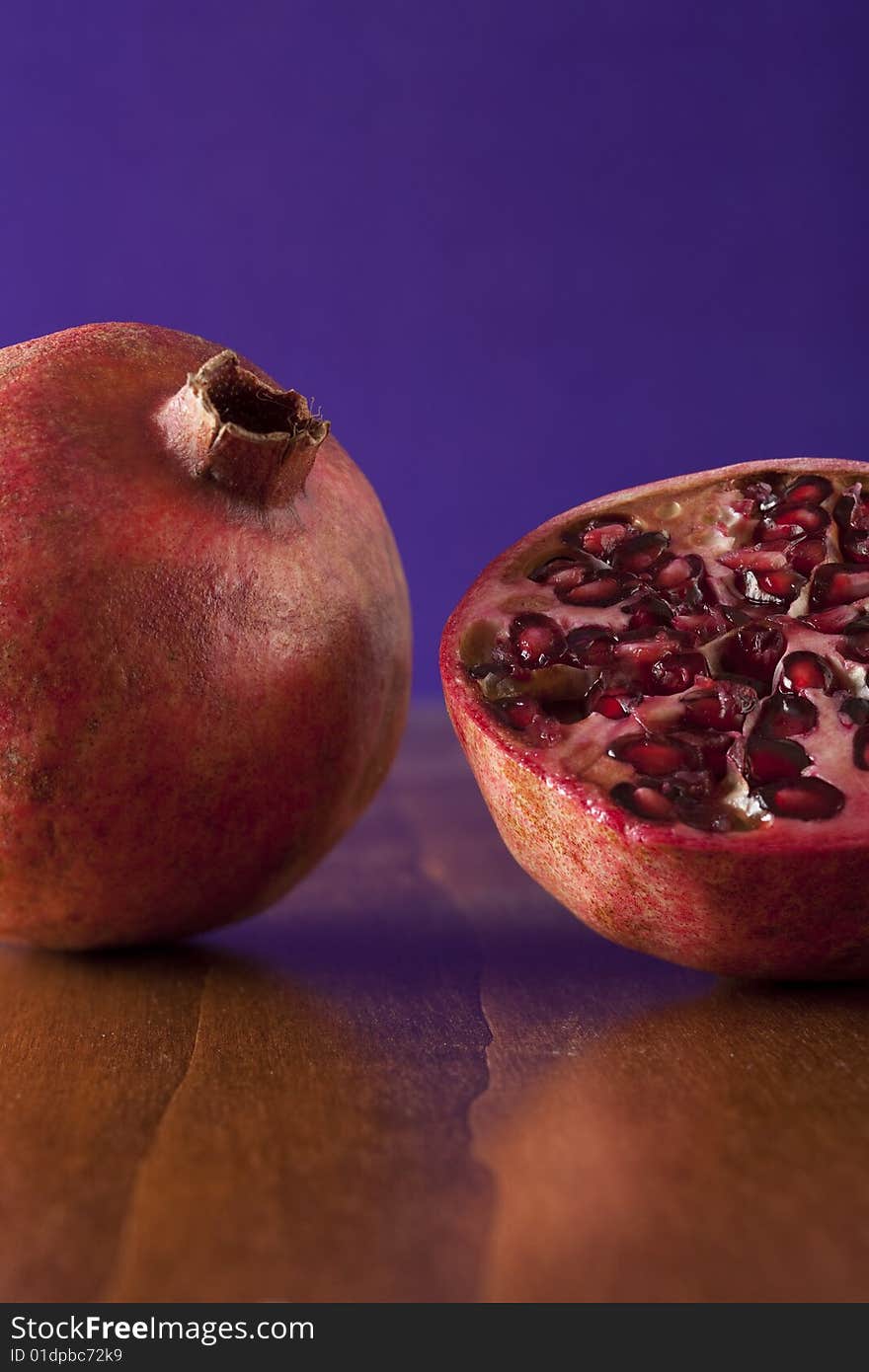 Fresh pomegranate halves, tropical fruit