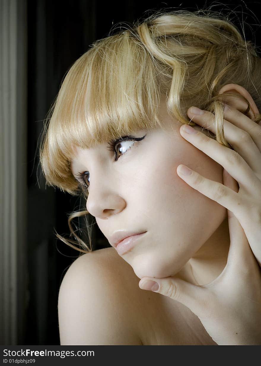 Young woman gazing out a window photo